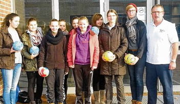 Foto der Mannschaft mit ihrem Coach